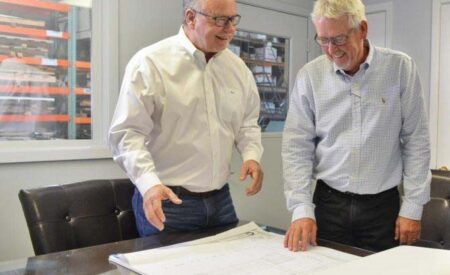 Blog team members looking at plans